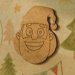 DIY MDF Santa Claus face cutout with engraved outline details and Christmas hat craft
