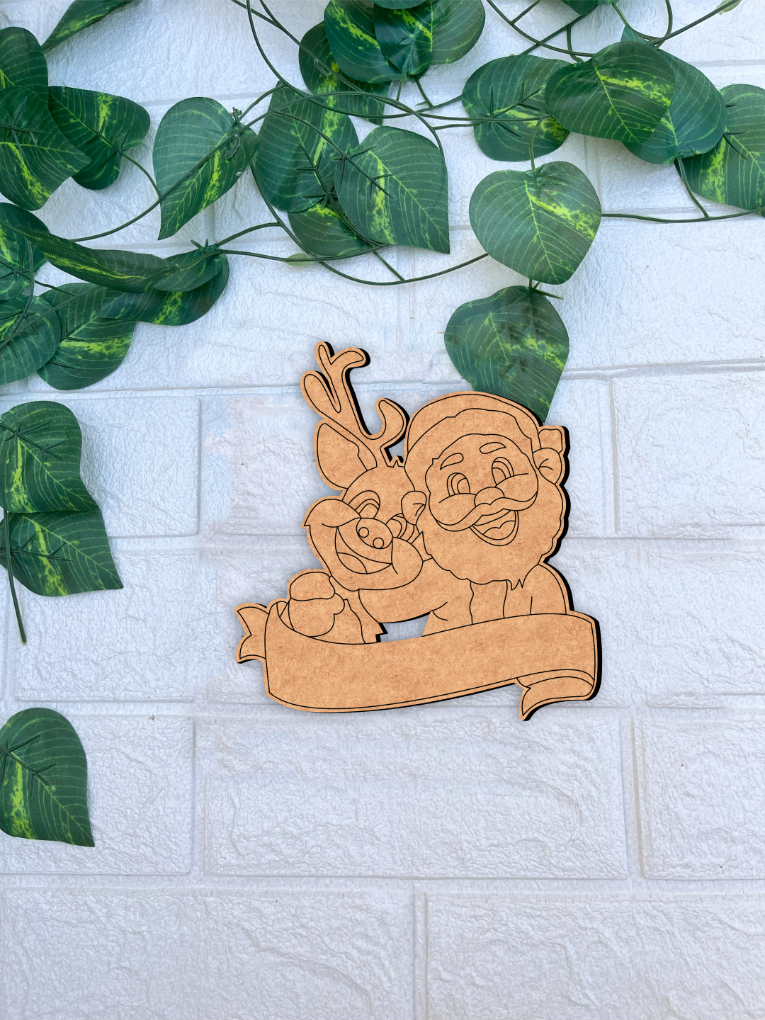 DIY MDF Santa and reindeer nameplate cutout with blank banner for personalization, Christmas craft base mounted on white bricks wall