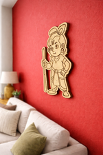 MDF DIY  wall decor of a cartoon character on a red wall with a sofa and lamp in the background.