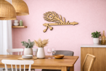 Dining room with wooden table, chairs, and decorative  MDF DIY  wall art on a pink wall.