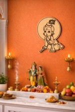 Decorative  MDF DIY  wall art of a child on an orange wall statues and offerings below.
