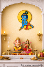 Decorative MDF DIY wall art of a bal krishna  figure on a yellow wall with statues and offerings below.