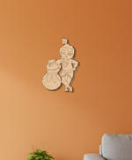  MDF DIY wall decoration of a child with a pot on an orange wall.
