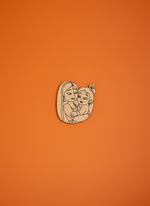  MDF DIY cutouts with a design of a woman holding a child on an orange background