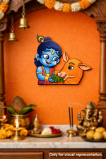 Decorative MDF DIY wall art of a child holding a cow against an orange wall with religious items below.