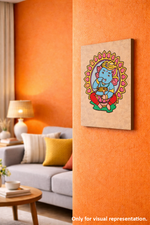 Decorative MDF DIY wall art of a colorful deity on an orange wall in a living room.