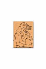 MDF DIY  wall art  with a line drawing of a krishna embracing a child on a white background