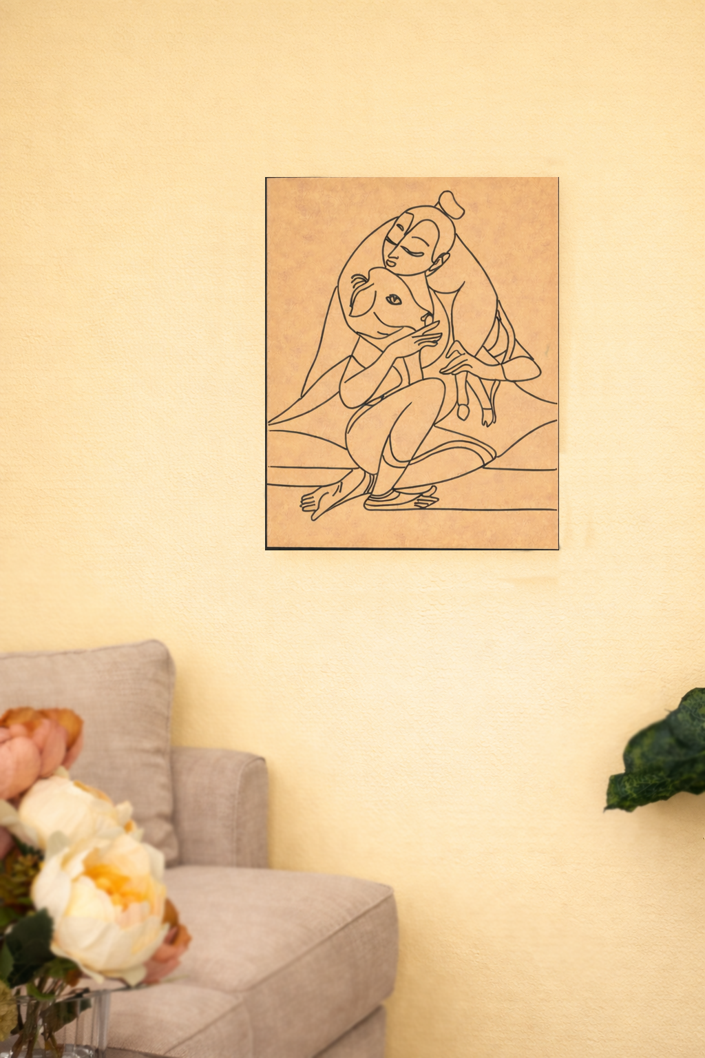 MDF DIY Line art of a krishna and a cow on a beige wall above a gray sofa.