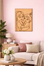MDF DIY  wall art of two people hugging on a pink wall above a sofa.