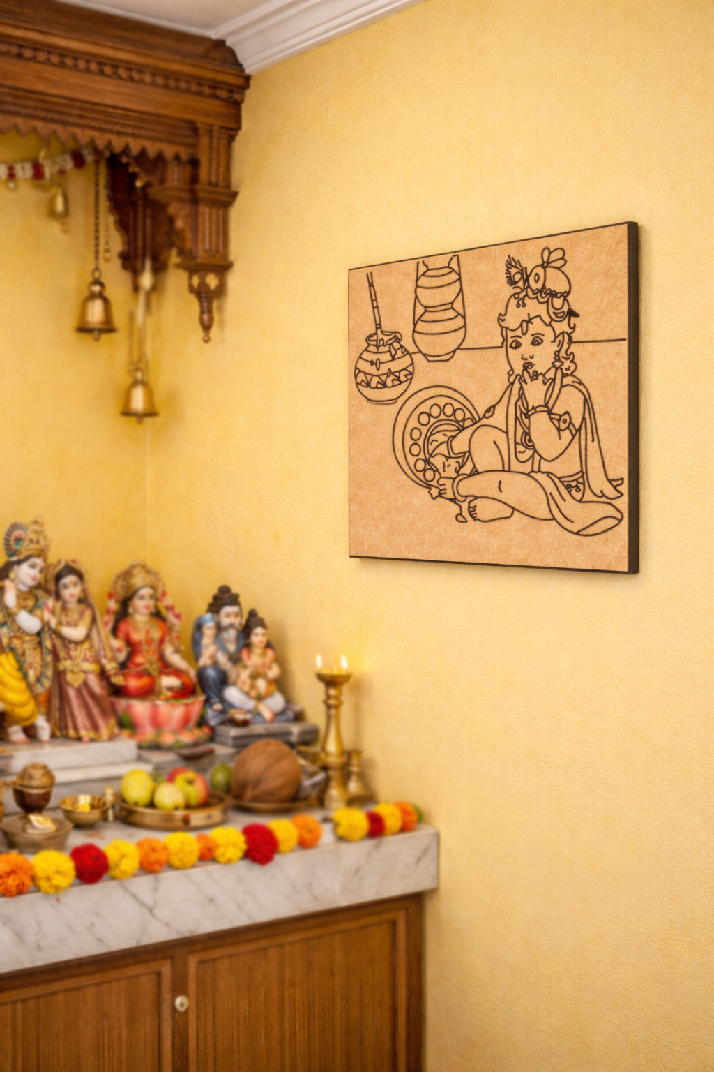 MDF DIY  wall art Pooja room with idols, flowers, and a wall hanging on a yellow wall.