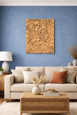 Living room with a beige sofa, wicker coffee table, and decorative MDF DIY wall art on a blue wall.