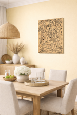 Dining room with a wooden table and chairs, decorative MDF DIY wall art, and a light fixture.