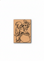 MDF DIY wall art with a design of two children playing with a drum on a white background