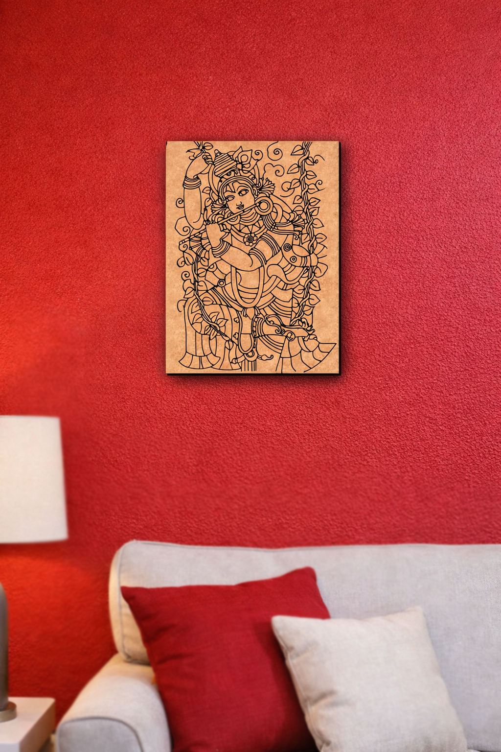 MDF DIY  wall art of a deity on a red wall above a sofa with red and white pillows.