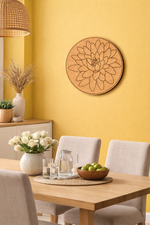 Dining room with a wooden table, chairs, and decorative  MDF DIY wall art against a yellow wall.