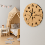MDF DIY  wall clock with star design on a light gray wall, next to a child's play area with a tent and table.