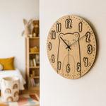 MDF DIY wall clock with bear design on a wall in a room.