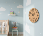 MDF DIY  clock with a cartoon character on a wall in a child's room.
