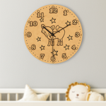 DIY MDF wall clock with animal design on a light gray wall