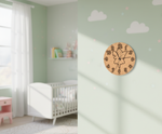 MDF DIY wall clock with butterfly design in a child's room with crib and toys.