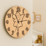 MDF DIY wall clock with fairy design on a beige wall.