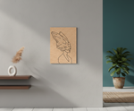 Minimalist line art of a woman with wings on a textured brown background, displayed in a modern interior setting.