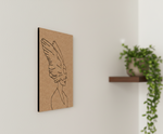 MDF DIY wall art with a line drawing of a woman with wings on a light beige wall.