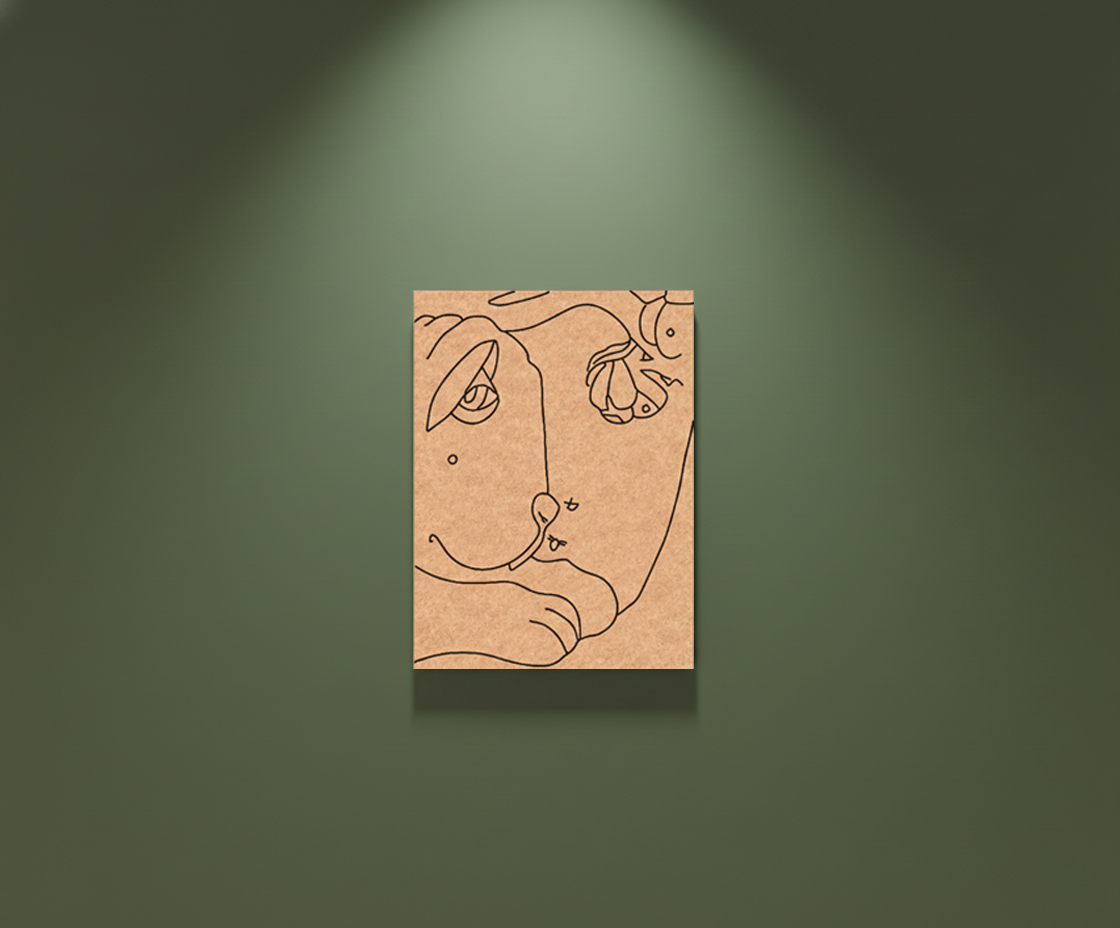 Abstract line art of a face on a beige card against a green wall