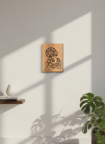 MDF DIY wall art with a design of a figure and child on a white wall with natural light casting shadows.