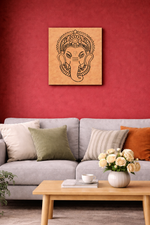 Living room with a gray sofa, wooden coffee table, and MDF DIY wall art of a face design.