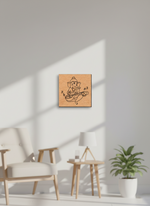 MDF DIY wall art of a deity figure on a white wall with a chair and plant in the foreground.
