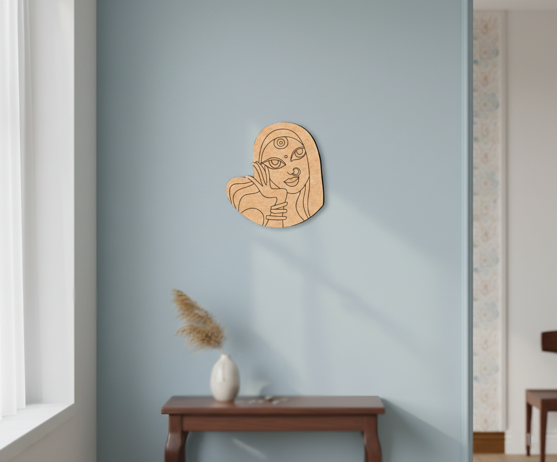 MDF DIY  wall art of a stylized face on a light blue wall with a vase below.