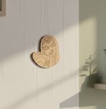 MDF DIY  wall art of a stylized face on a light wooden panel