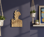 DIY MDF  wall art of a man with a turban on a dark blue wall.