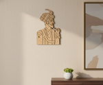 DIY MDF wall art of a man with a turban on a beige wall next to a framed picture.