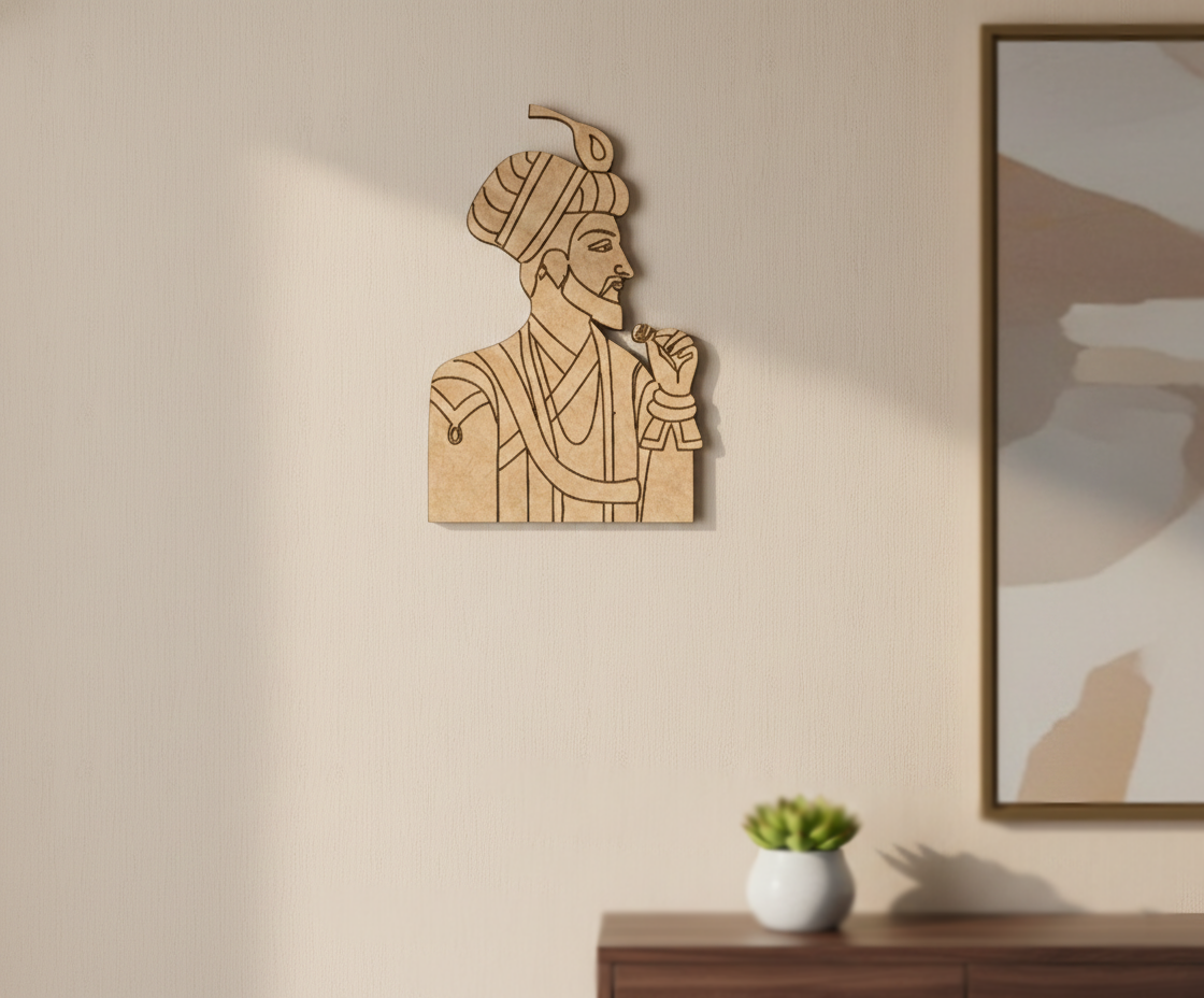DIY MDF wall art of a man with a turban on a beige wall next to a framed picture.
