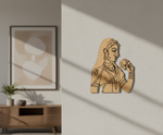 MDF DIY wall art of a woman holding a flower on a light gray wall.