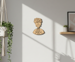 MDF DIY  wall art of a man with a turban on a light gray wall.