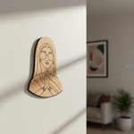 MDF DIY  wall art of a woman's face with glasses on a plain wall.