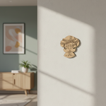 MDF DIY wall decoration of a men's face with a headscarf on a light gray wall.