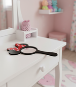 Minnie bow MDF mirror lying flat on a kids’ vanity table.