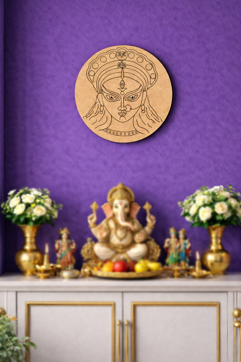 Decorative  DIY MDF Durga  wall piece with a face design above an altar with a statue and offerings on a purple wall.