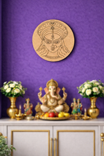 Decorative  DIY MDF Durga  wall piece with a face design above an altar with a statue and offerings on a purple wall.