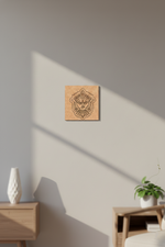 Wooden MDF DIY wall art piece on a light gray wall with a vase and plant in the foreground.
