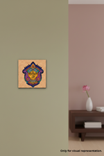 Decorative MDF DIY wall art on a beige wall with a vase and flowers on a table.