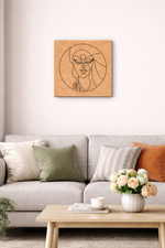 Living room with a gray sofa, decorative pillows, a coffee table with a vase of flowers, and a MDF DIY framed artwork on the wall.