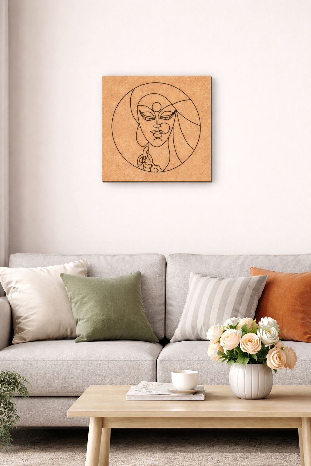 Living room with a gray sofa, decorative pillows, a coffee table with a vase of flowers, and a MDF DIY framed artwork on the wall.
