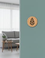 Wooden MDF DIY wall art with a face design on a light blue wall in a living room.