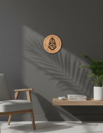 Wooden MDF DIY wall art piece on a gray wall with a chair and plant in the foreground