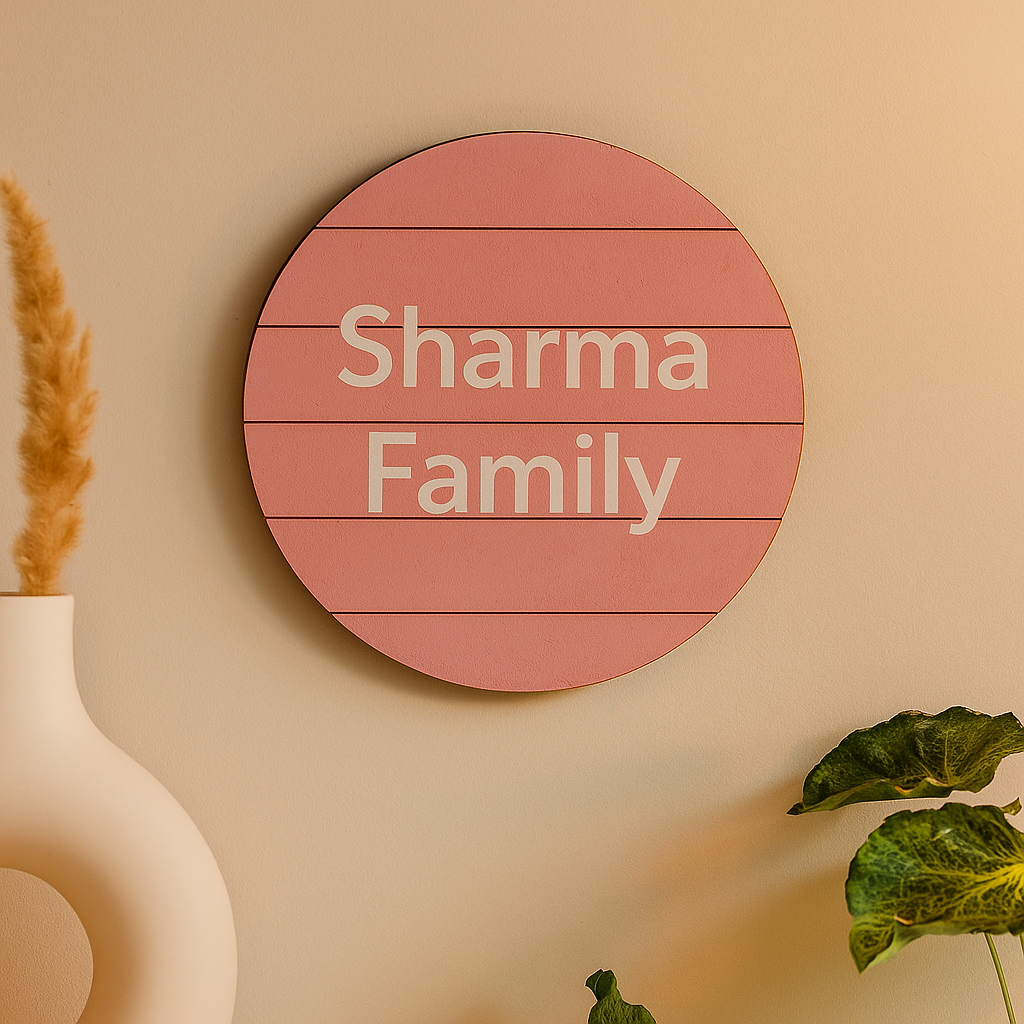 Round MDF board with 'Sharma Family' text on a beige wall.